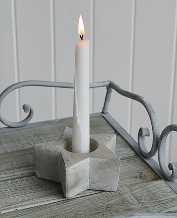 Grey star candle holder on Grayswood table