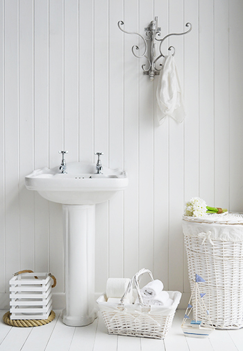 White BAthroom with hooks and baskets