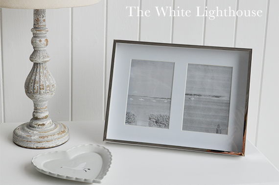 Decorate your console table with photographs for a homely feel.