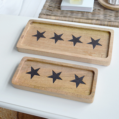 A wooden tray with stars, perfect for serving in A New England styled home coastal or farmhouse interior