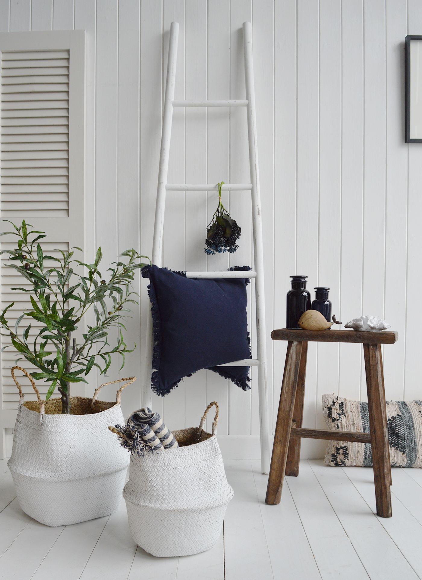 Classic Blue and White Interiors with the Proincetown white ladder against shades of blues in the accessories and cushions with the rustic Georgetown stool