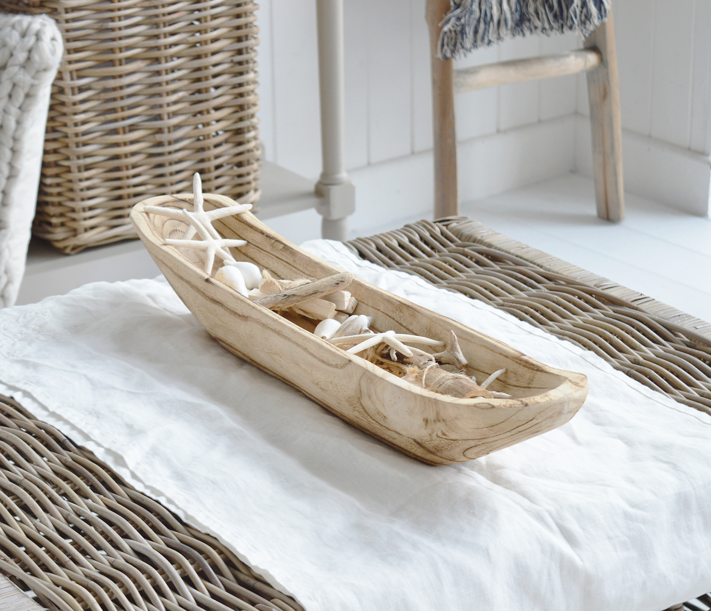 Chadwick dough bowl filled with coastal pieces for styling a Hamptons style coffee table