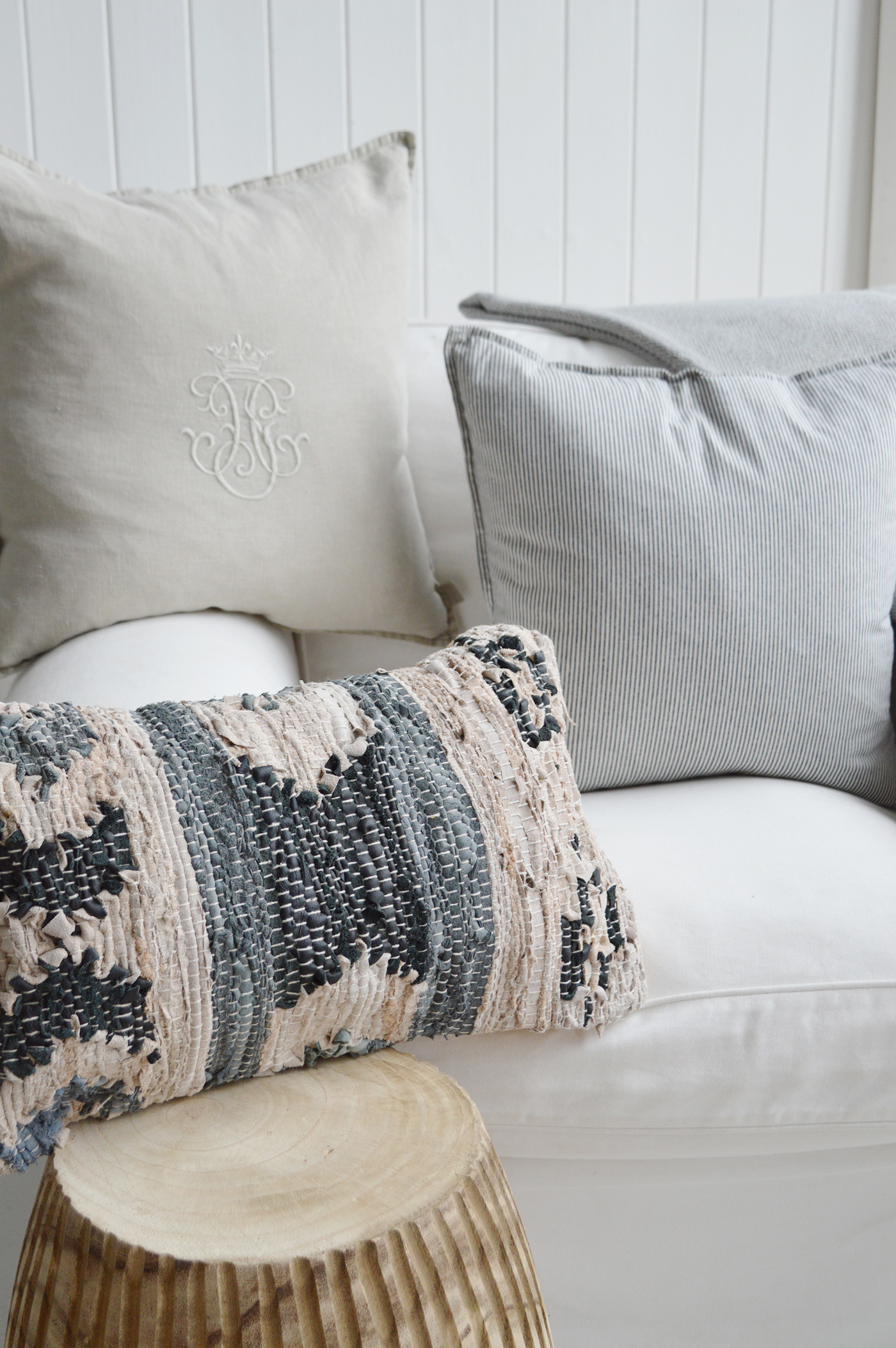 The Dalton cushion with the Rhode Island stripe and Richmond monogram in naturals, blues, and greys to suit a Hamptons Beach House inspired interior