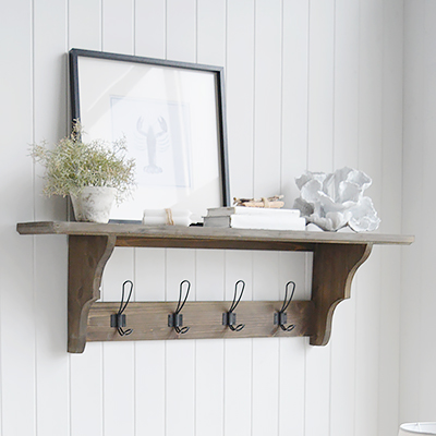 The handcrafted Hampden Rustic Wooden Hampden coat rack for function and charm. Made from wood, this coat rack features a spacious shelf for extra storage, beautifully scalloped detailing for a touch of vintage elegance