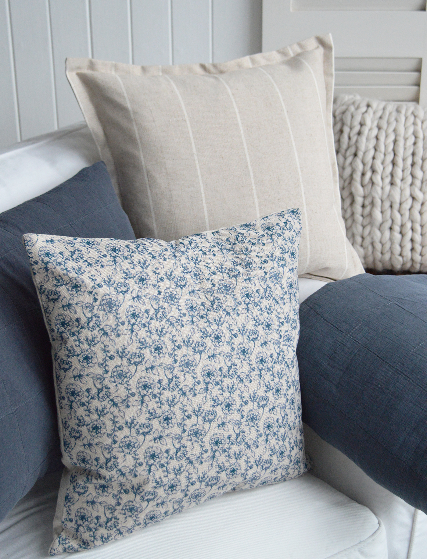 Navy range of cushions covers and throws to furnish a Namptons coastal inspired home interior