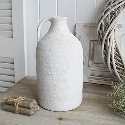 The Fremont aged white stone vases feature a weathered, textured finish that exudes rustic charm for all coastal and farmhouse settings