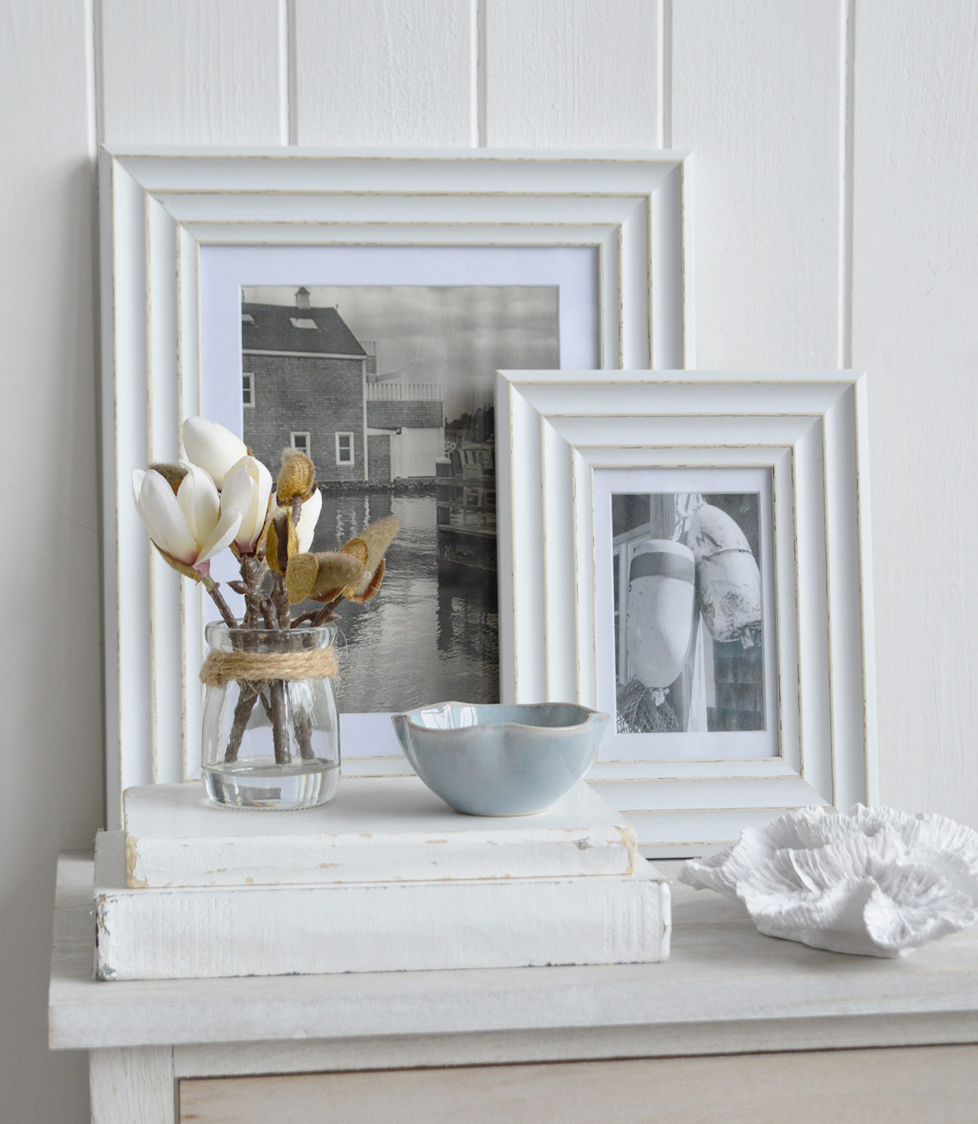 Hamptons beachhouse inspired coastl interiors with hints of white and blkue, faux coral and a Magnolia Sprig