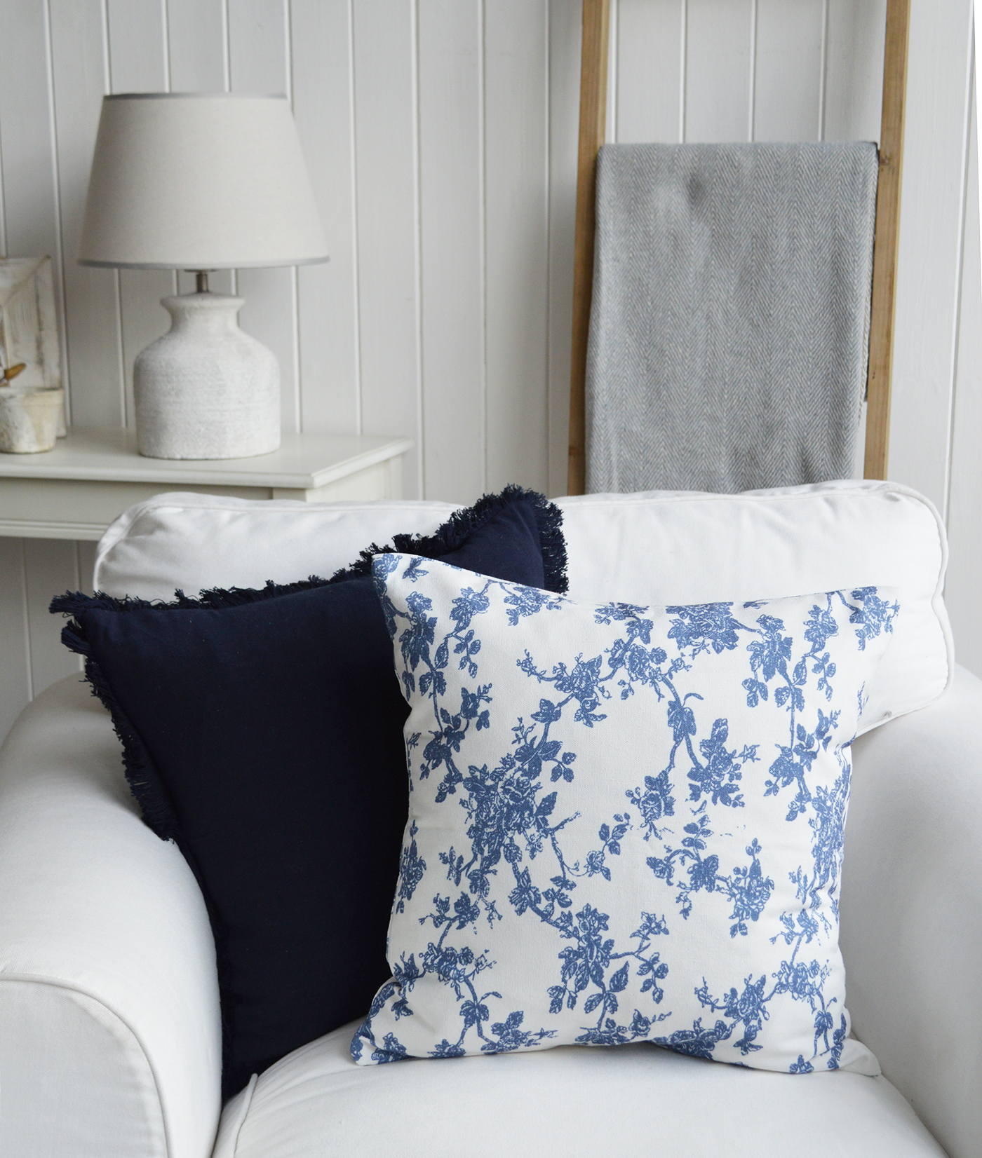 Blue and white floral cushion