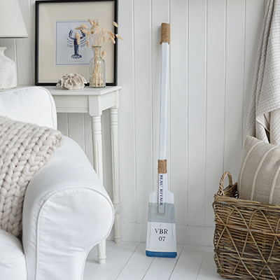 Nautical charm with a refined edge — this decorative oar, painted in classic white and blue, captures the breezy elegance of Newport’s famous harborfront. A perfect accent for beach houses, boathouse-inspired spaces, or maritime lovers.