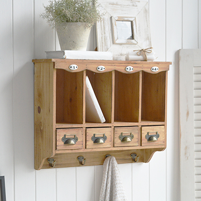 Add timeless coastal New England style to your home with our Springfield Shelf. This rustic wooden wall organiser features drawers, hooks and cubbies – perfect for relaxed coastal interiors and classic New England inspired furniture schemes.