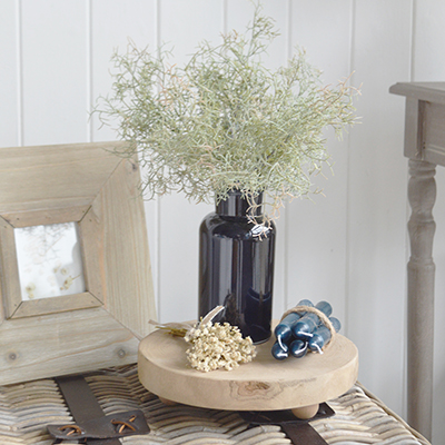 Create a coastal cottage look with the Seaside Cottage Bundle, combining a blue vase, faux greenery, wooden stand, decorative flowers and blue candles.