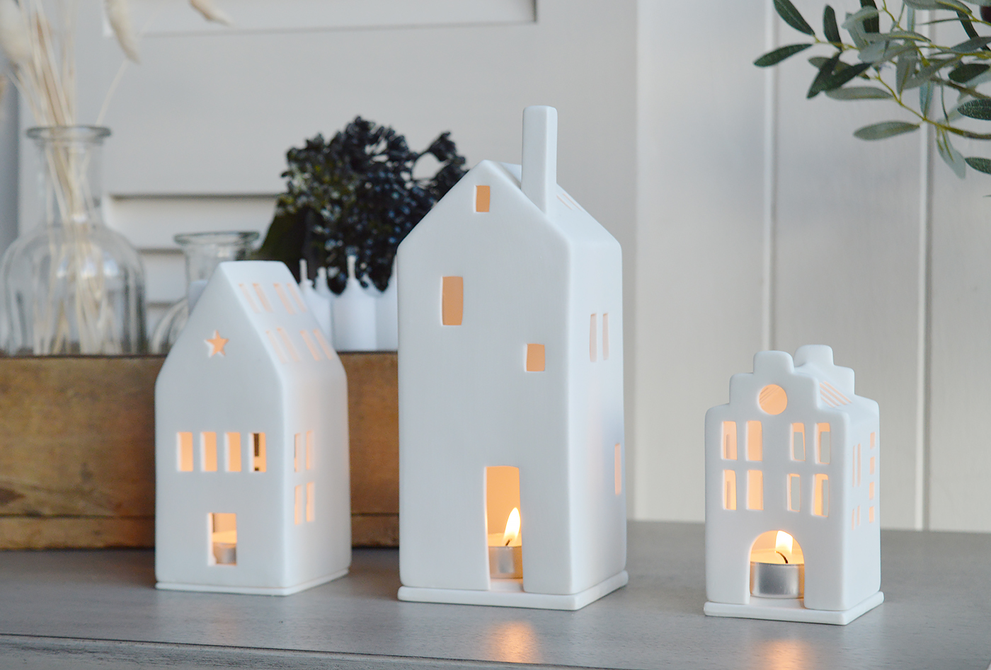 Coastal New England Furniture and decor accessories. Hallway, Living room, bedroom and bathroom. White porcelian townhouse tealight holders