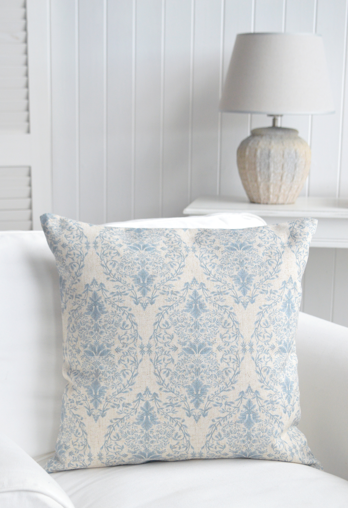 The White Lighthouse. The Bristol rectangle luxurious cushion in soft blue grey and natural hues printed on a linen mix basecloth with a feather inner in a traditional but simple damask style design