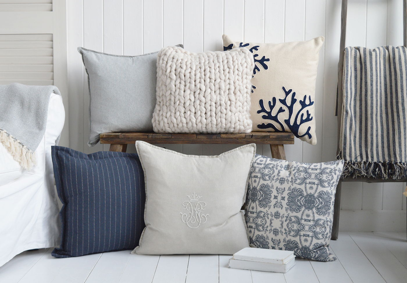 A combination of cushions in navy and naturals to complement a Hamptons, New England farmhouse or coastally inspired home interior