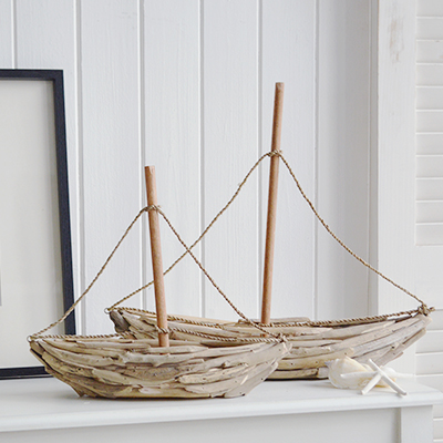 Handcrafted driftwood yachts bring rustic charm to coastal décor. Perfect for nautical, beach house, or seaside-inspired interiors, these decorative sailboats add natural texture and maritime style.