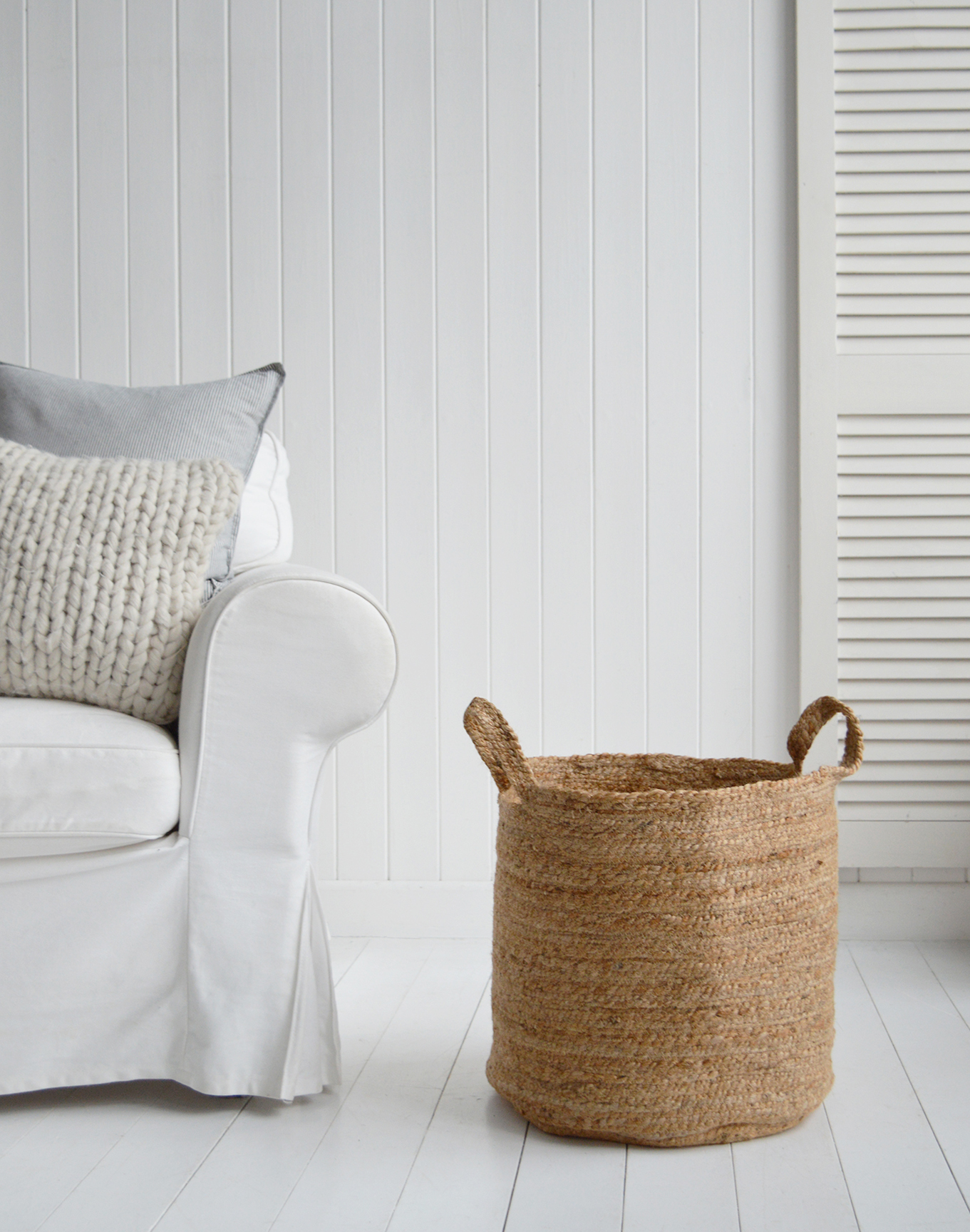 The Fall River basket, a perfect height basket beside a sofa