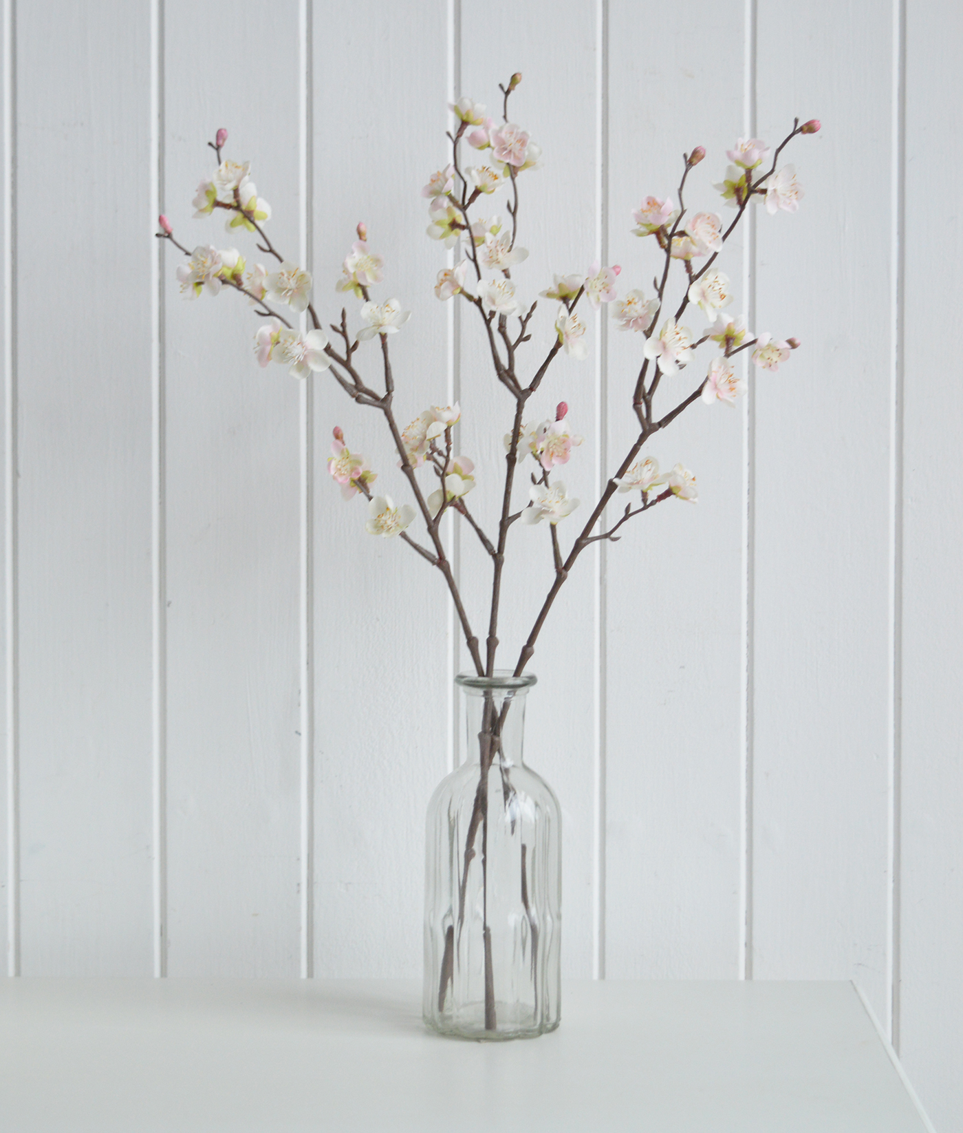 Faux blossom srpay stem for styling a peaceful and serene timeless New England interior in pure white homes