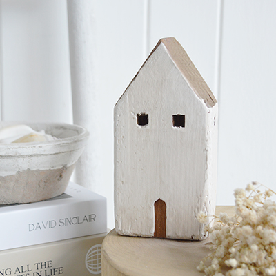 The chalky white finish and natural wood detail make it ideal for modern coastal and modern country interiors. A timeless neutral home accessory designed to complement beach house interiors and understated, elegant spaces.