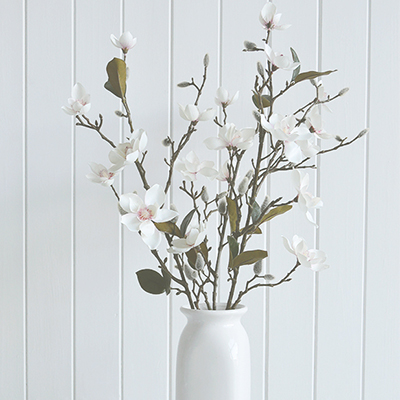 An artificial Magnolia branch with multiple flowers, leaves and buds on a realistic stem

A fabulously gorgeous and realistic magnolia branch