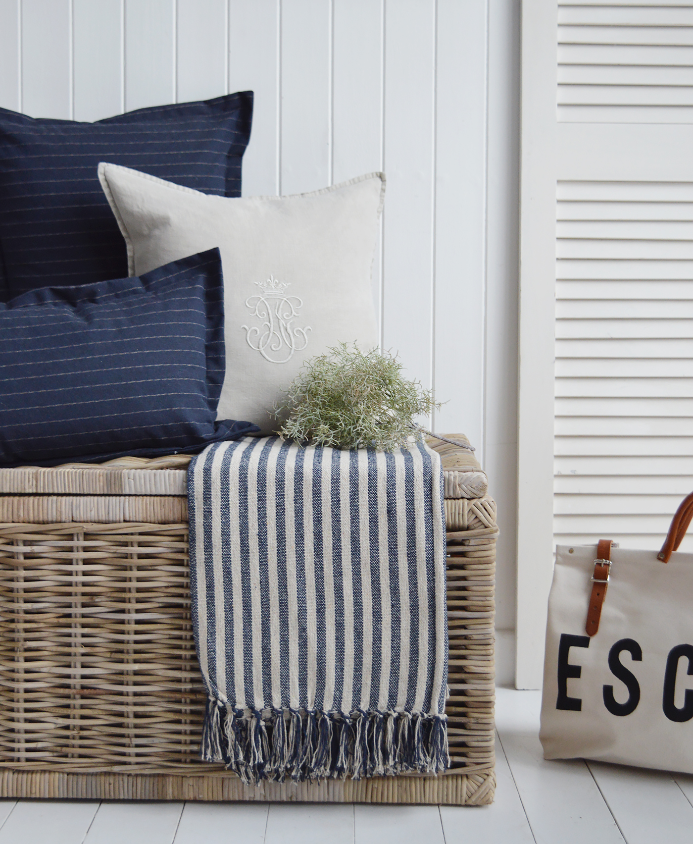 Beachhouse navy decor for a home by the sea. Navy and beige soft furnishings. The navy Mapleton throw alongside the Richmond linen and Peabdy navy cushions