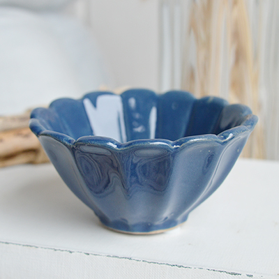 This small blue pilgrim bowl features a scalloped edge and a smooth, glossy glaze that captures the essence of the sea. Perfect for coastal interior