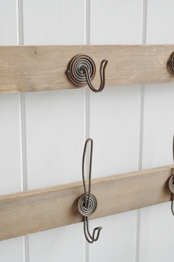 Pawtucket wooden wall shelf with hooks in greyed wood for the living room, bathroom, hallway or bedroom. Perfectly complements coastal, country and white furniture in New England Interiors and homes from The White Lighthouse. Close image of hooks