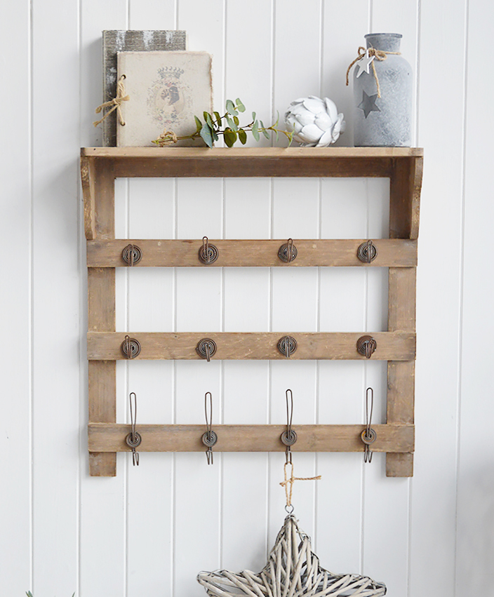 Pawtucket wooden wall shelf with hooks in greyed wood for the living room, bathroom, hallway or bedroom. Perfectly complements coastal, country and white furniture in New England Interiors and homes from The White Lighthouse. Display or coat storage