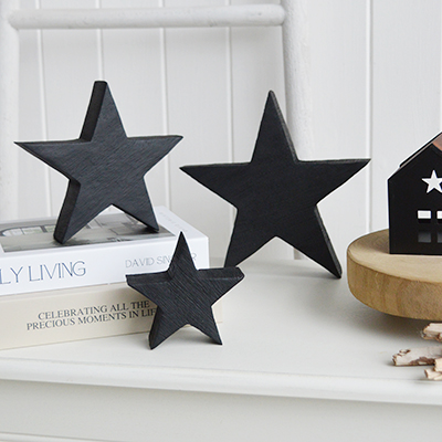 Style the wooden black stars on shelves, consoles or stacked books for relaxed New England coastal interiors.
