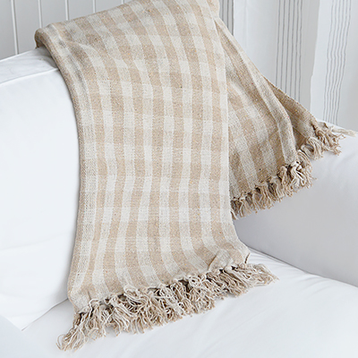 Style your home with the Stowe Sand Check Throw, a beautifully woven coastal throw that adds warmth and texture to any neutral interior.