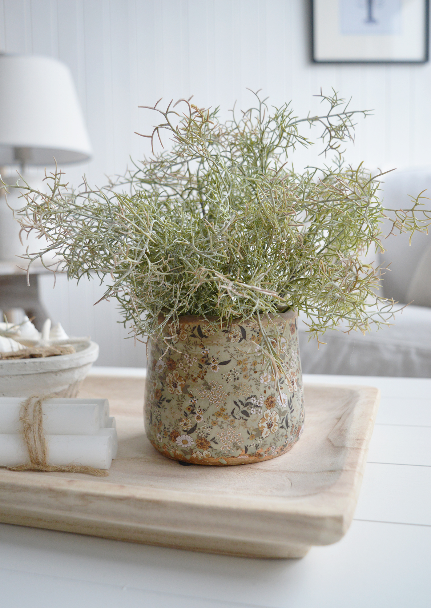 A wooden display tray styled with aged ceramic pots creates a timeless and elegant vignette, blending rustic charm of the Pepperell vintaged pots with a touch of antique sophistication.