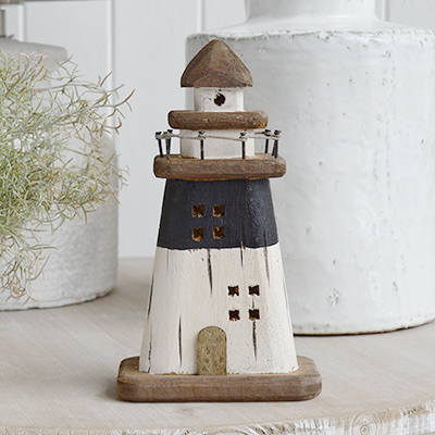 Rustic driftwood wooden lighthouse for decorating a coastal room