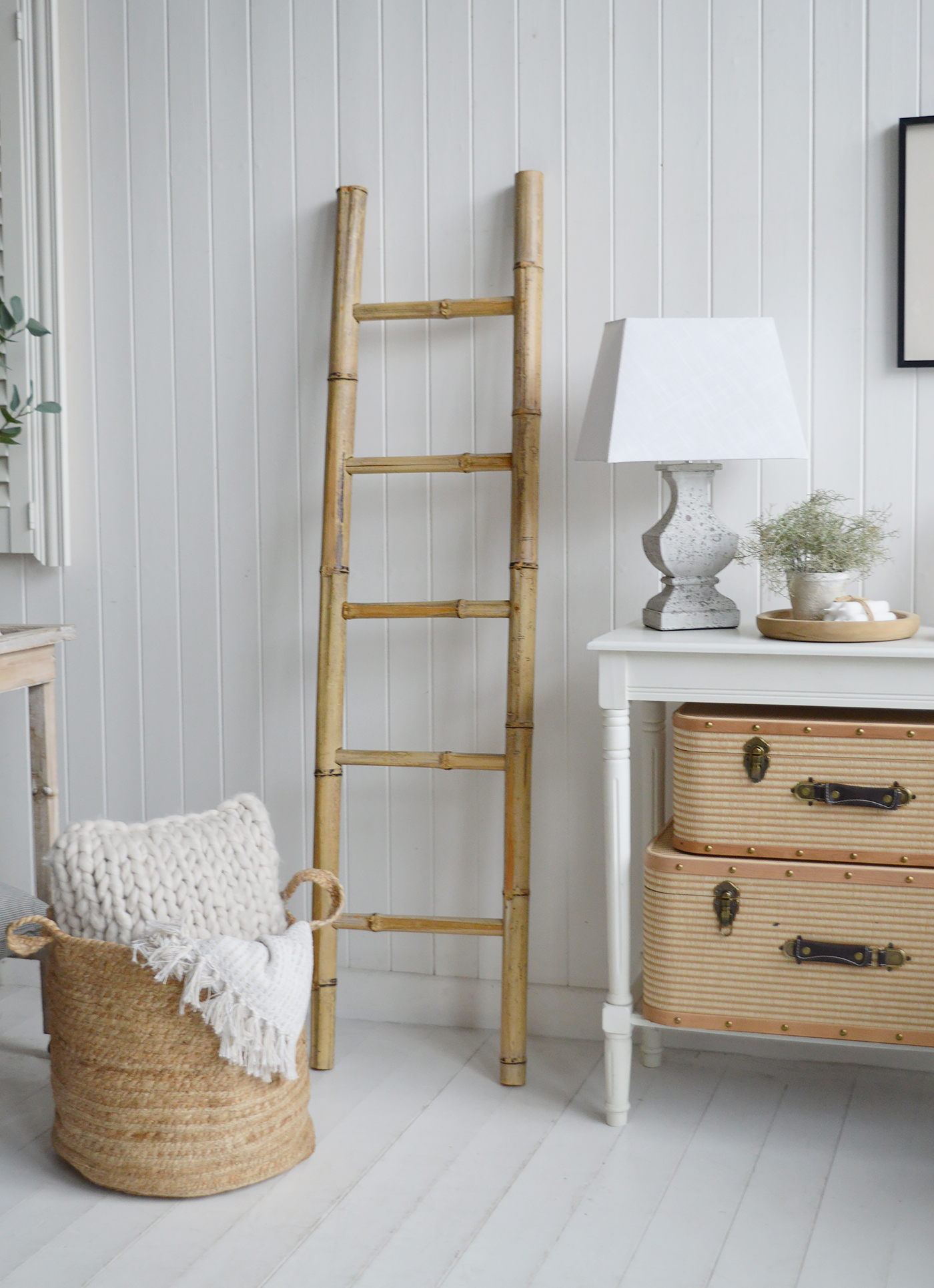 Coastal cottage design celebrates texture and tone, bringing warmth and softness to bright, white rooms.