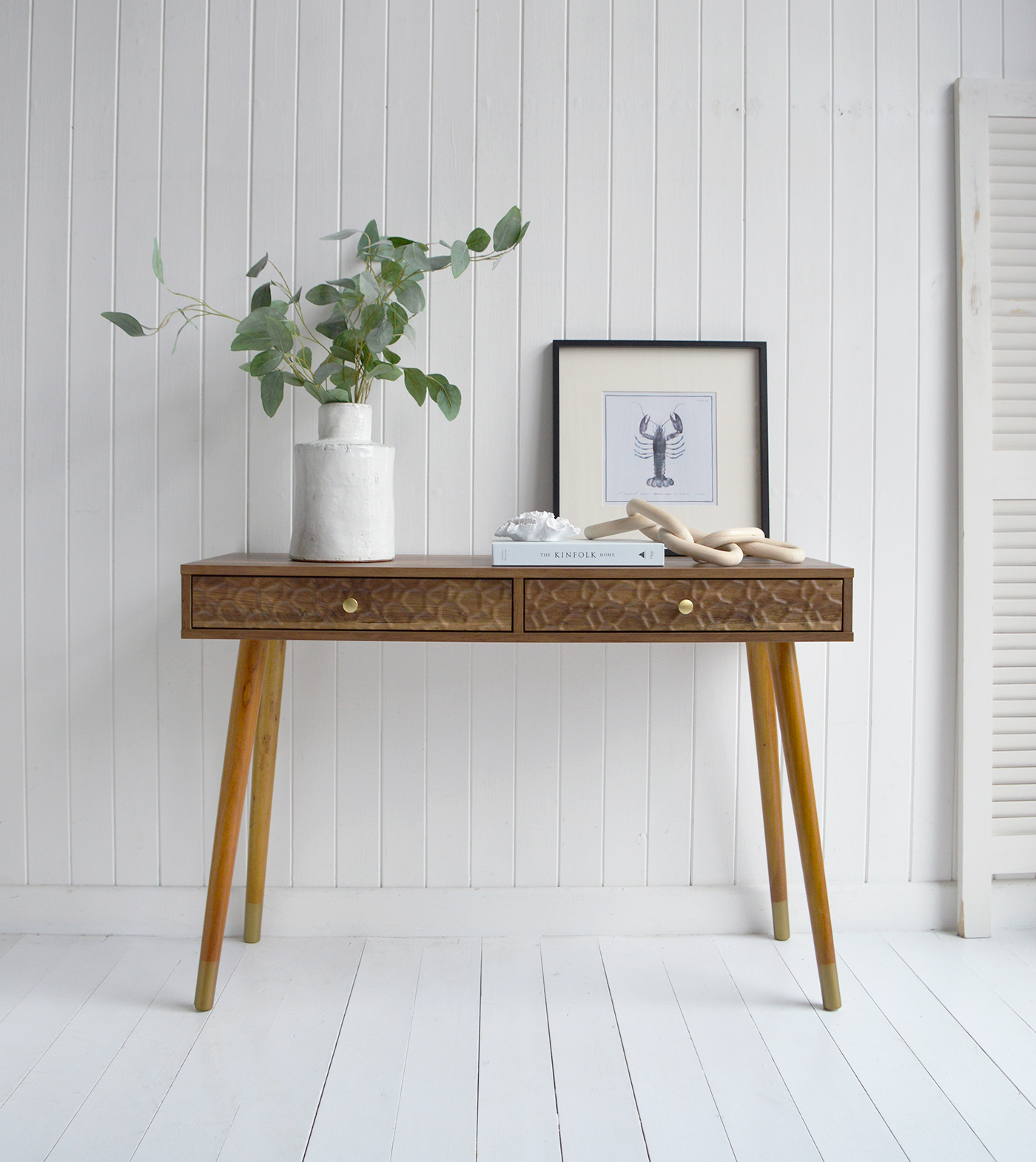 The Windsor console table with two drawers. With a minimal simple design, the Windsor table exhibits organic charm with the wood veneer finish along with rustic texture and warmth from the rippled drawers for coastal interiors