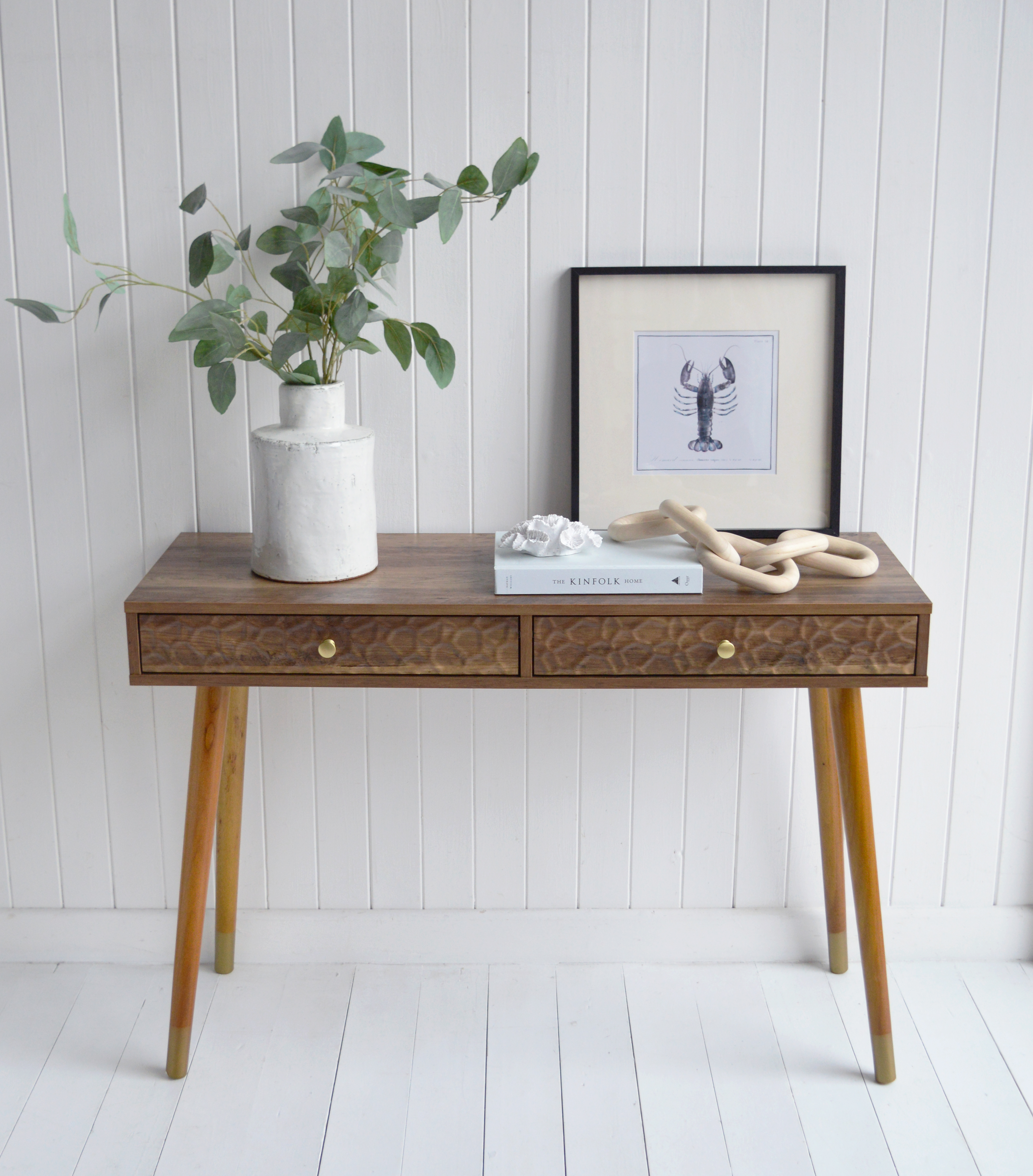 The Windsor console table with two drawers. With a minimal simple design, the Windsor table exhibits organic charm with the wood veneer finish along with rustic texture and warmth from the rippled drawers for Hamptons coastal interiors