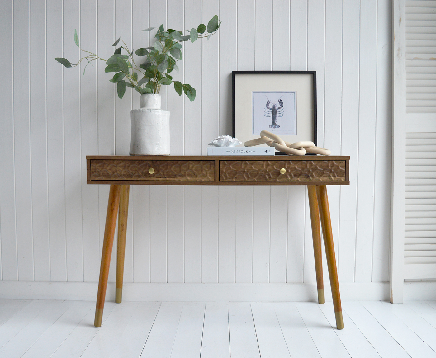 The Windsor console table with two drawers. With a minimal simple design, the Windsor table exhibits organic charm with the wood veneer finish along with rustic texture and warmth from the rippled drawers for New England interiors