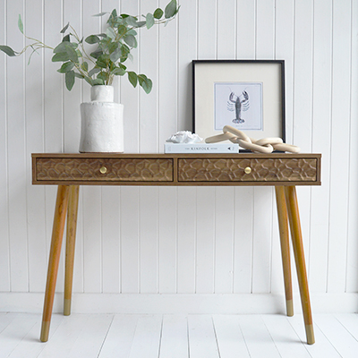 The Windsor console table with two drawers. With a minimal simple design, the Windsor table exhibits organic charm with the wood veneer finish along with rustic texture and warmth from the rippled drawers for coastal interiors