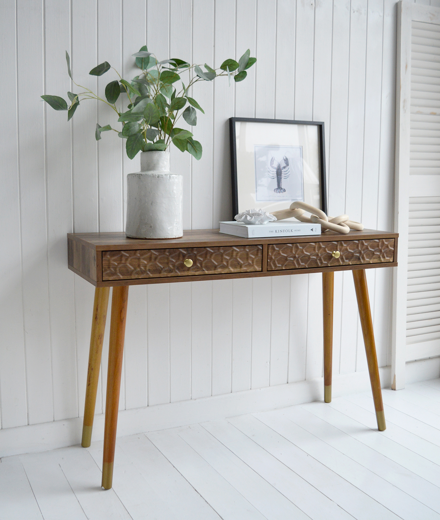 The Windsor console table with two drawers. With a minimal simple design, the Windsor table exhibits organic charm with the wood veneer finish along with rustic texture and warmth from the rippled drawers for beach house styled interiors