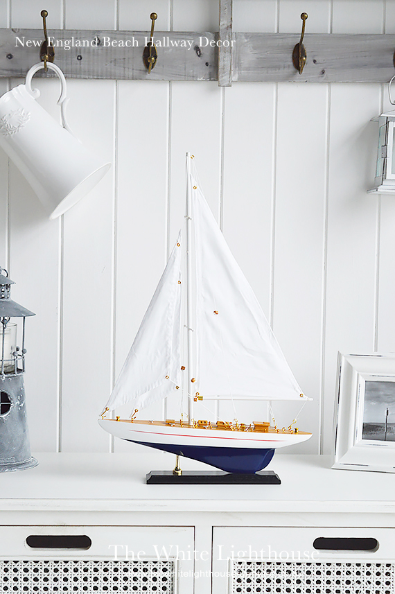 Decorate your New ENgland home with coastal accessories, warming woods and bright home decor