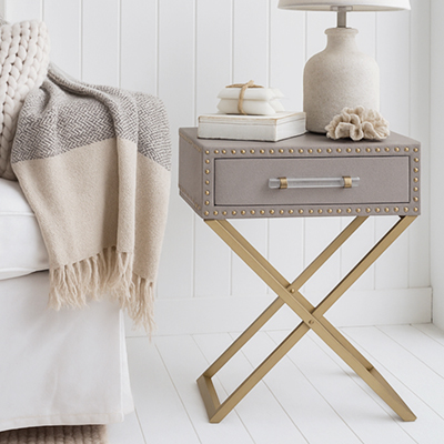 The Amity lamp table with a natural linen finish pairs beautifully with rattan, wicker, and other textures found in classic New England and Hamptons homes.