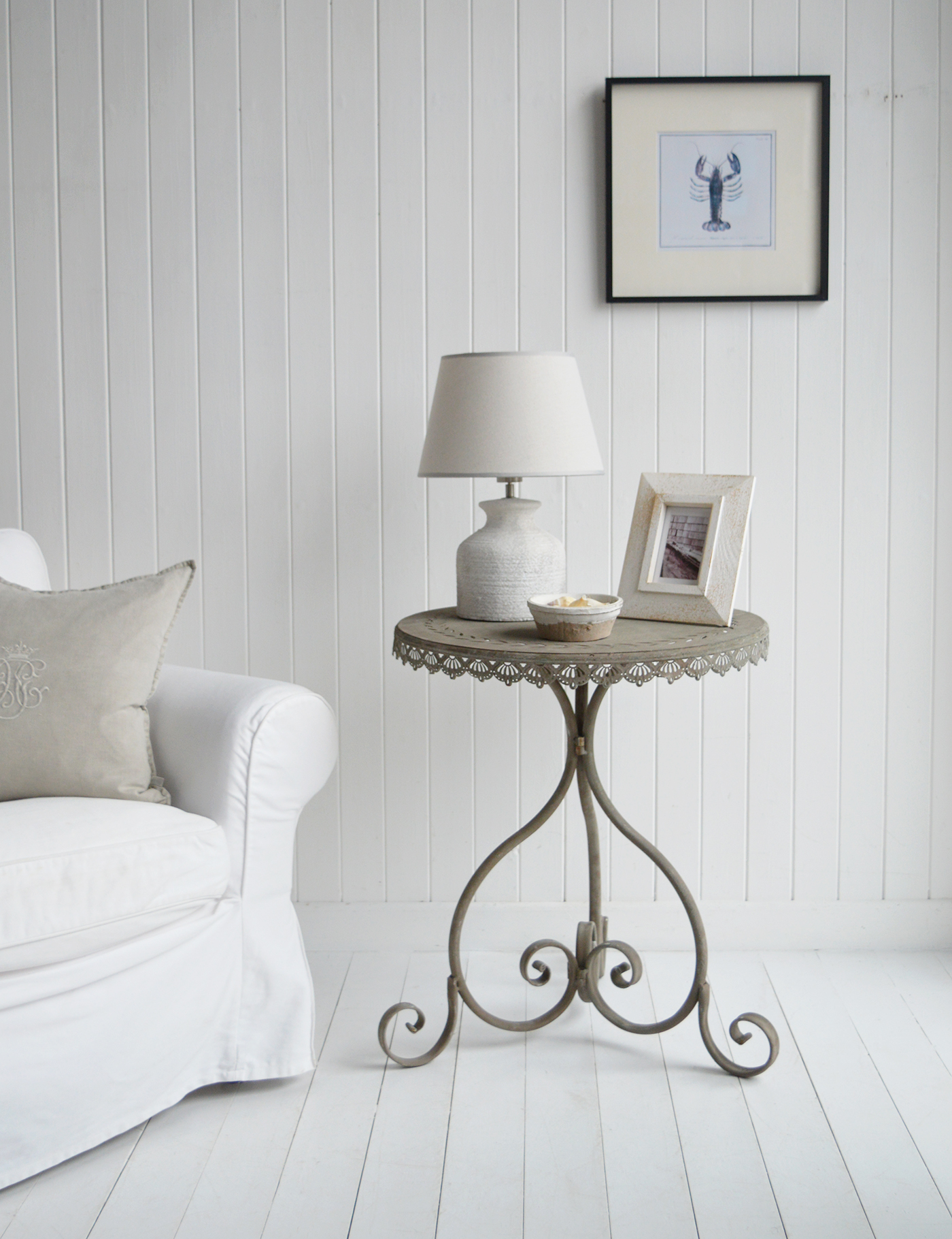 The Charleston Grey Metal Rustic Table blends industrial charm with farmhouse warmth, making it a perfect fit for New England coastal interiors. 