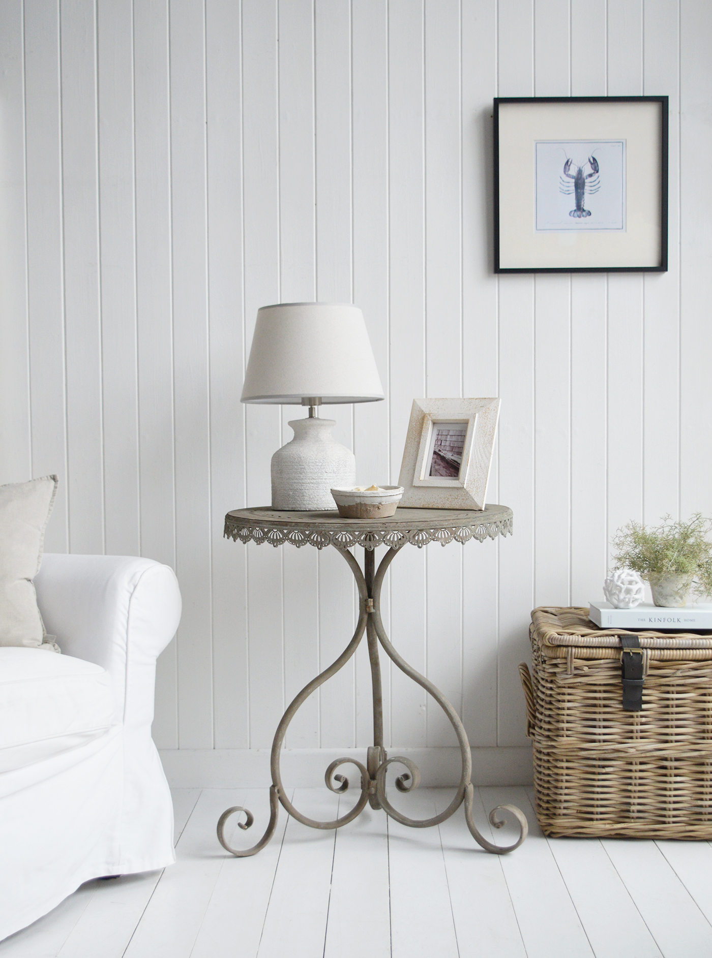 Its neutral grey metal finish allows the table to pair beautifully with natural wood tones and airy coastal palettes in farmhouse homes.