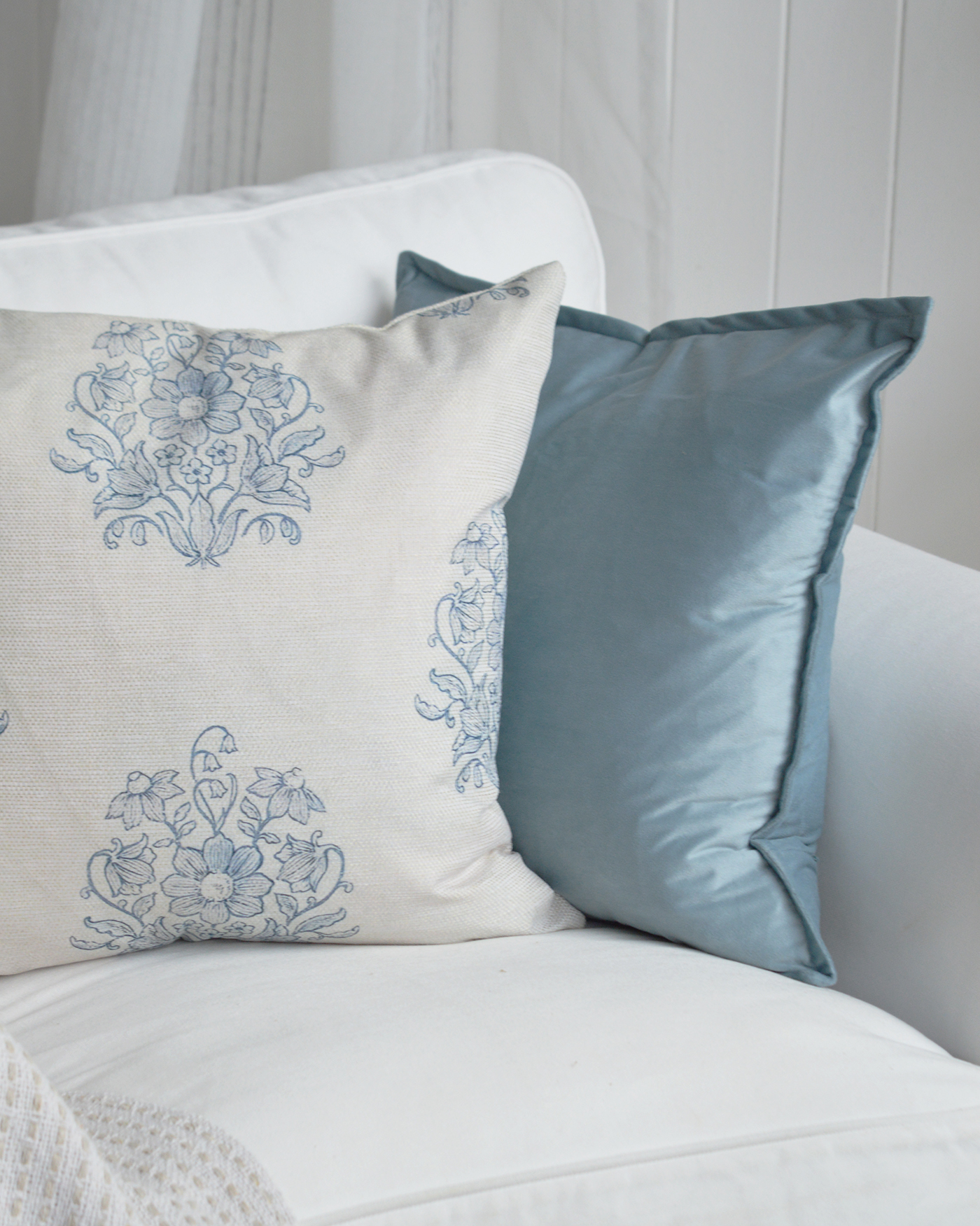 White furniture and sandy neutral tones create the perfect foundation for relaxed coastal interiors.