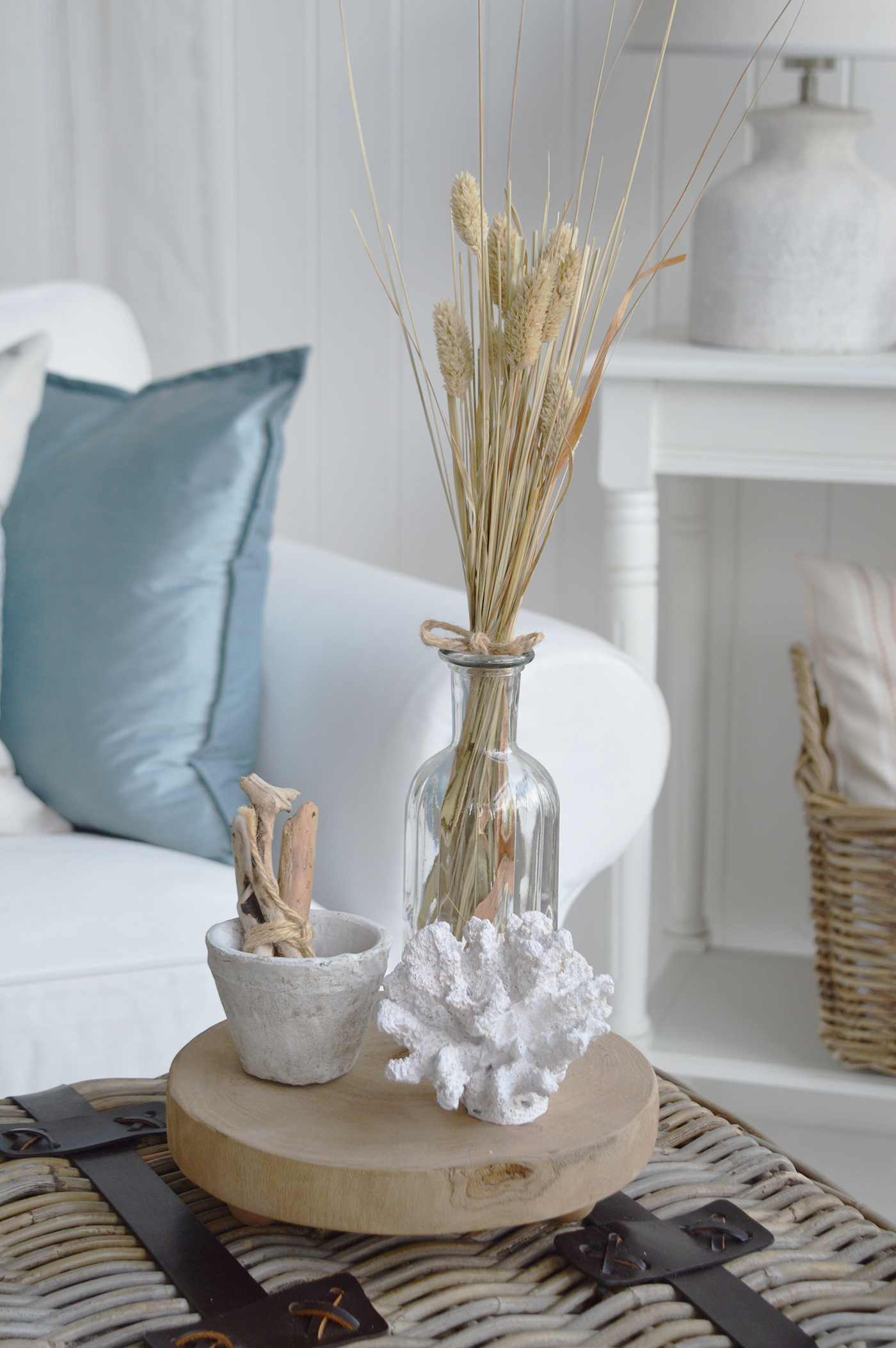 Woven baskets, weathered wood and soft fabrics create an effortlessly comfortable beach house interior.