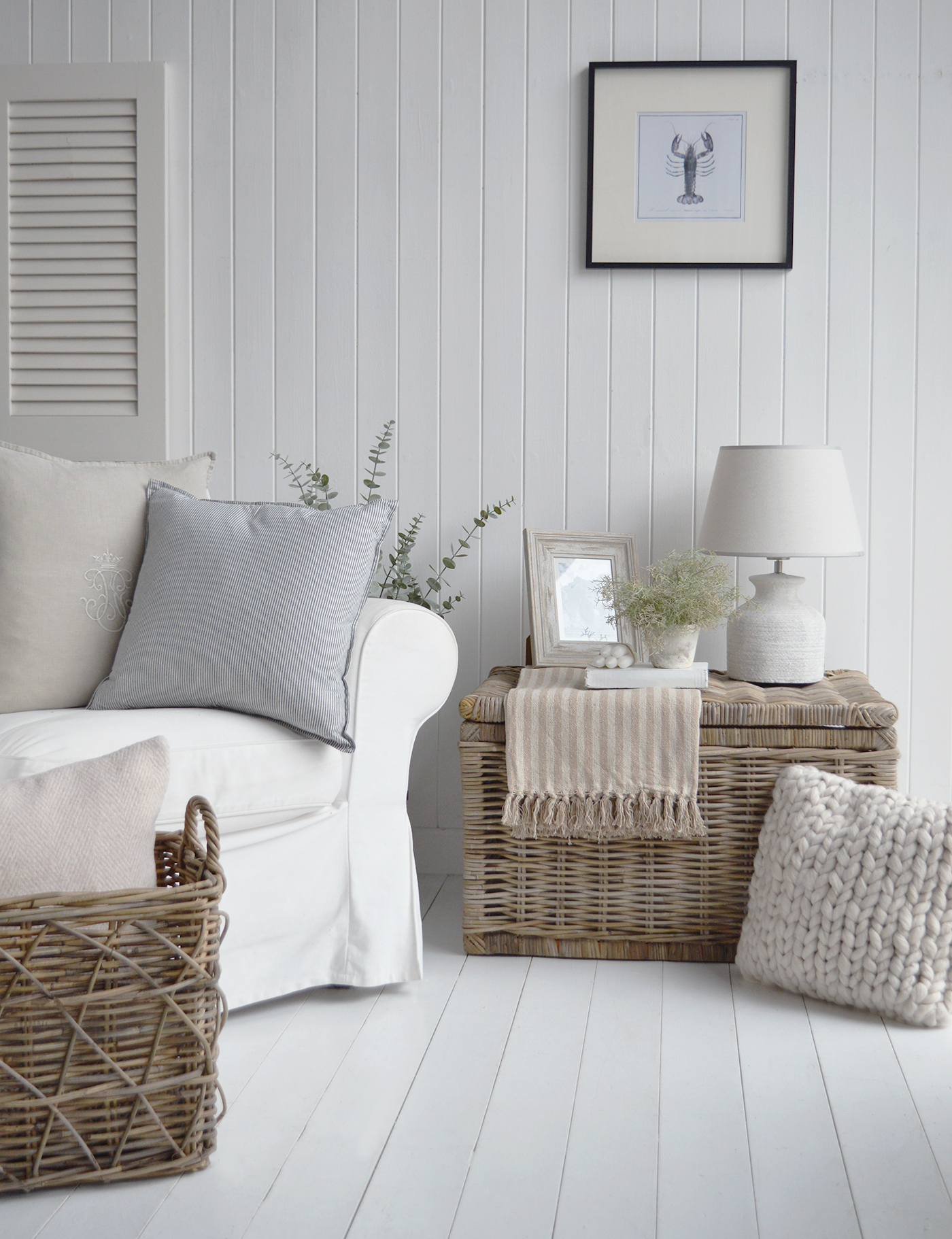 The Seaside basket as a side table, shown with the Barnstead lamp and Hamptons style decor in the living room