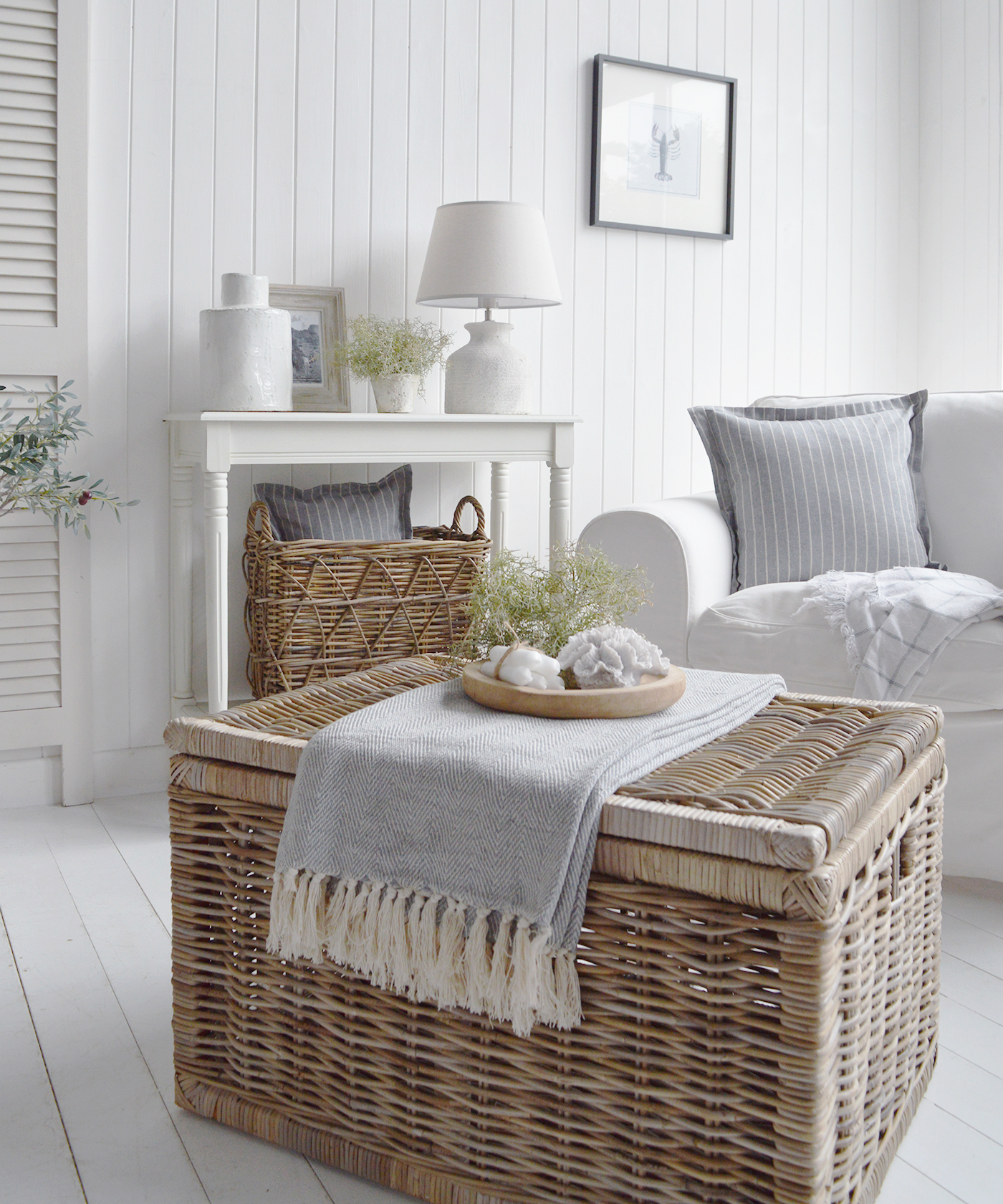 The large Seaside coffee table for a beach house living room. Pitcured here with a throw and coastal decor on a wooden tray for a chic opulent look