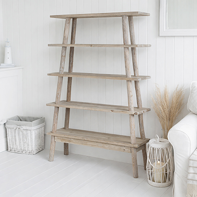 A beautifully weathered driftwood shelf unit that adds warmth, texture and practical storage to relaxed, neutral and coastal interiors.