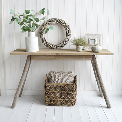 Inspired by the raw beauty of nature, this driftwood effect console table exudes refined elegance with its soft, weathered finish and coastal style furniture