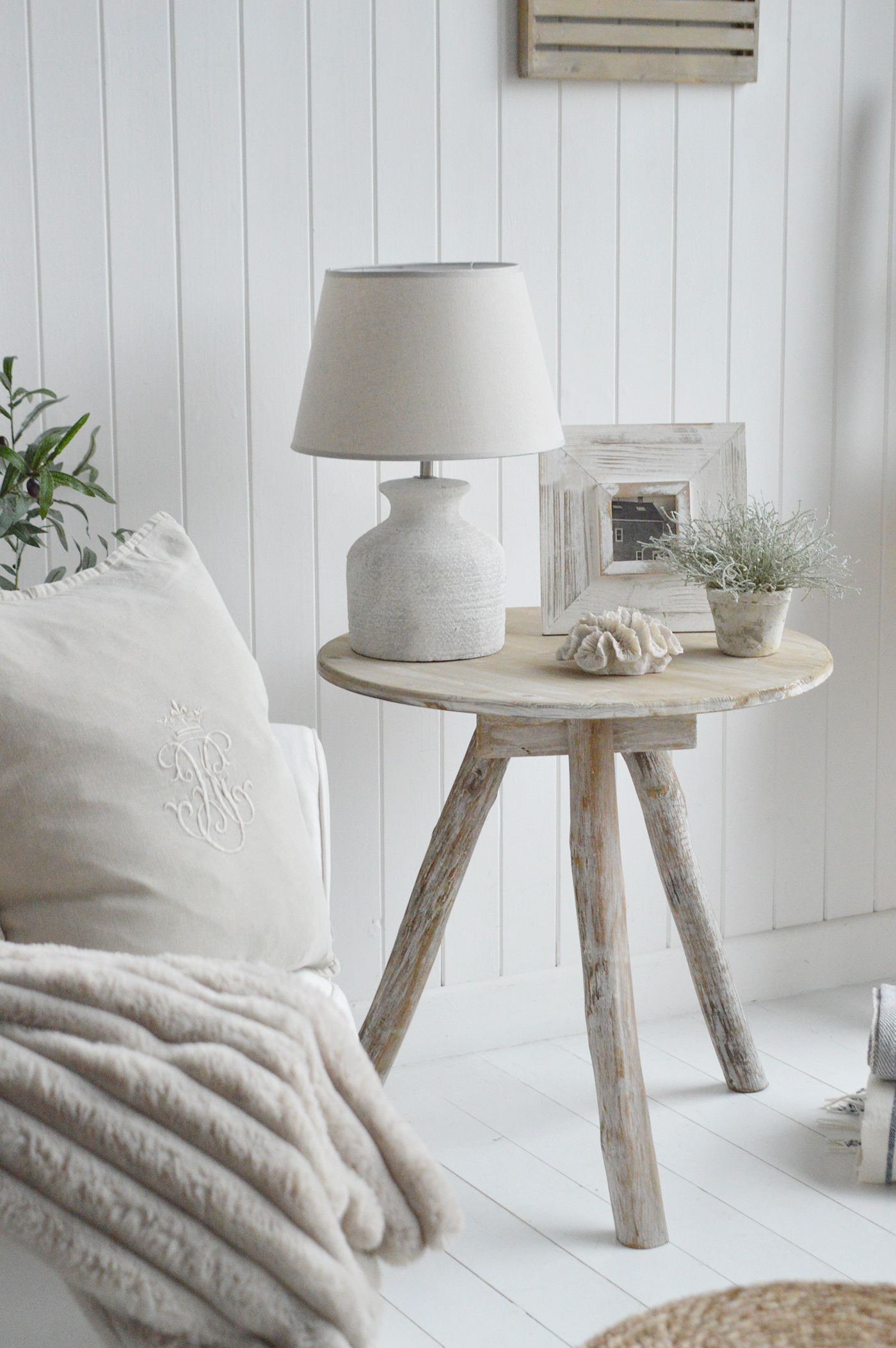 The driftwood wooden side table in a neutrally inspired modern country home interior