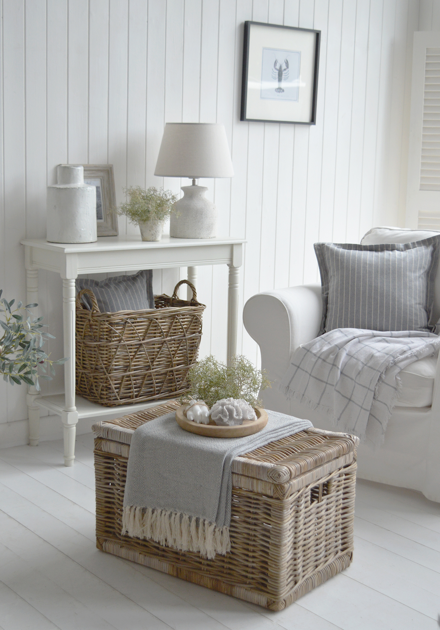 New England and Hamptons white coastal living room with the Seaside Basket as a coffee table and Cape Ann aged white console table with the Casco Bay basket for stroage and dimension