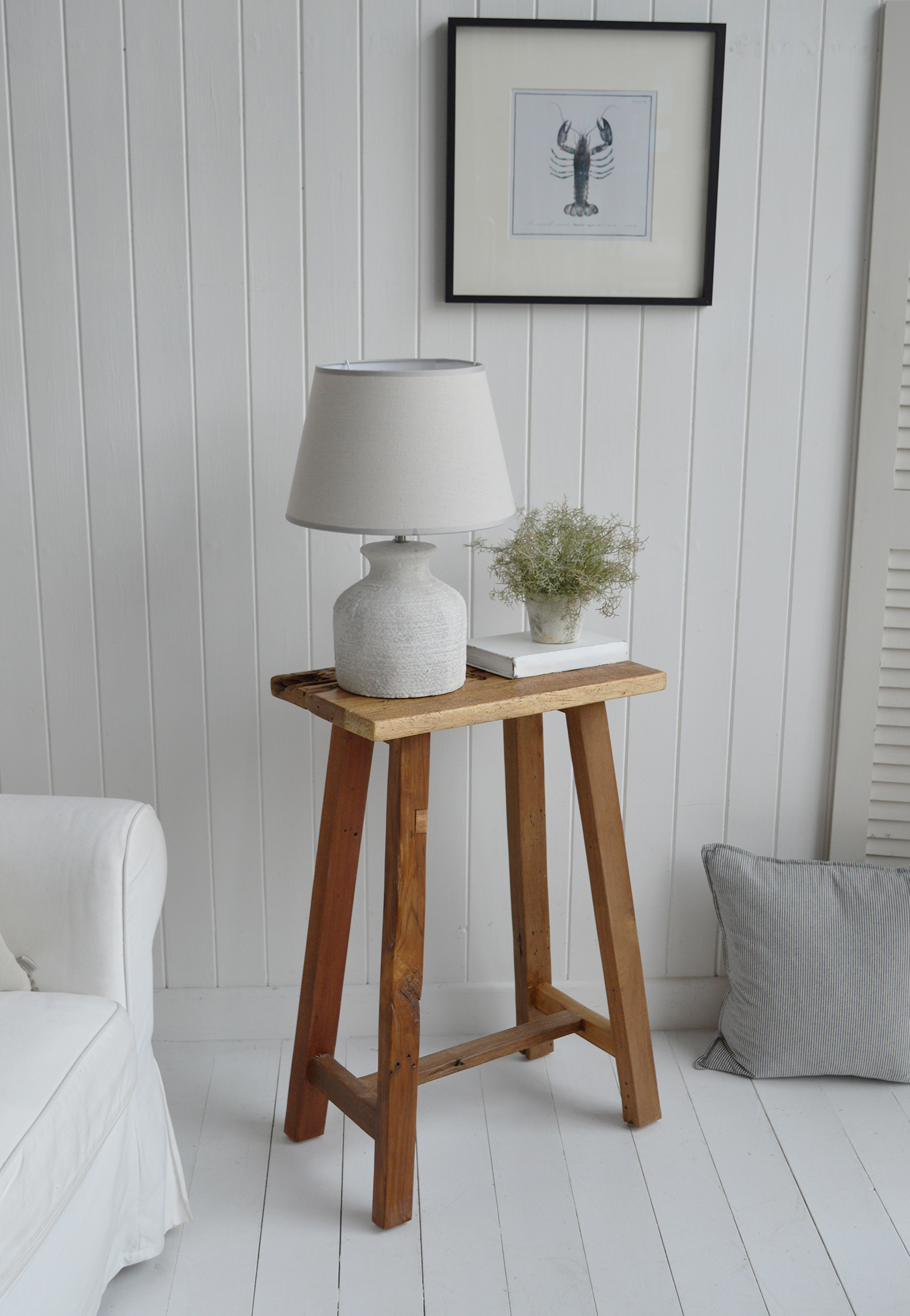 Peabody rustic teak wooden stool as a lamp or side table in a coastal New England inspired home